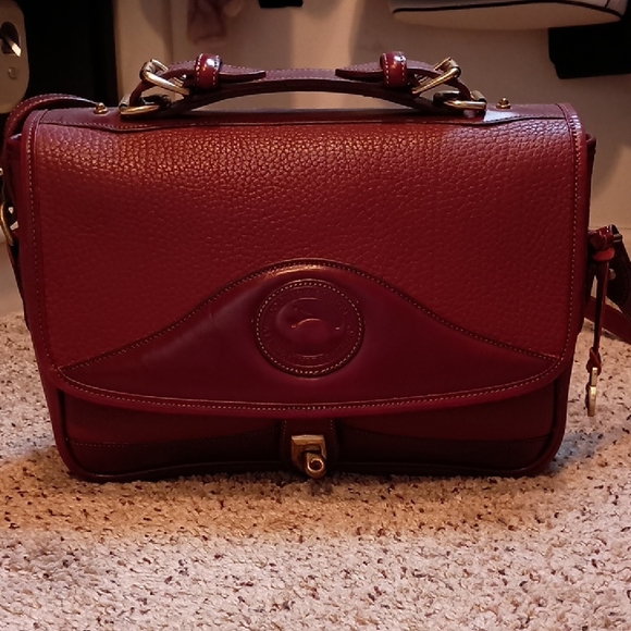 Dooney & Bourke Handbags - Dooney & Burke Elegant Burgundy Leather Handbag
